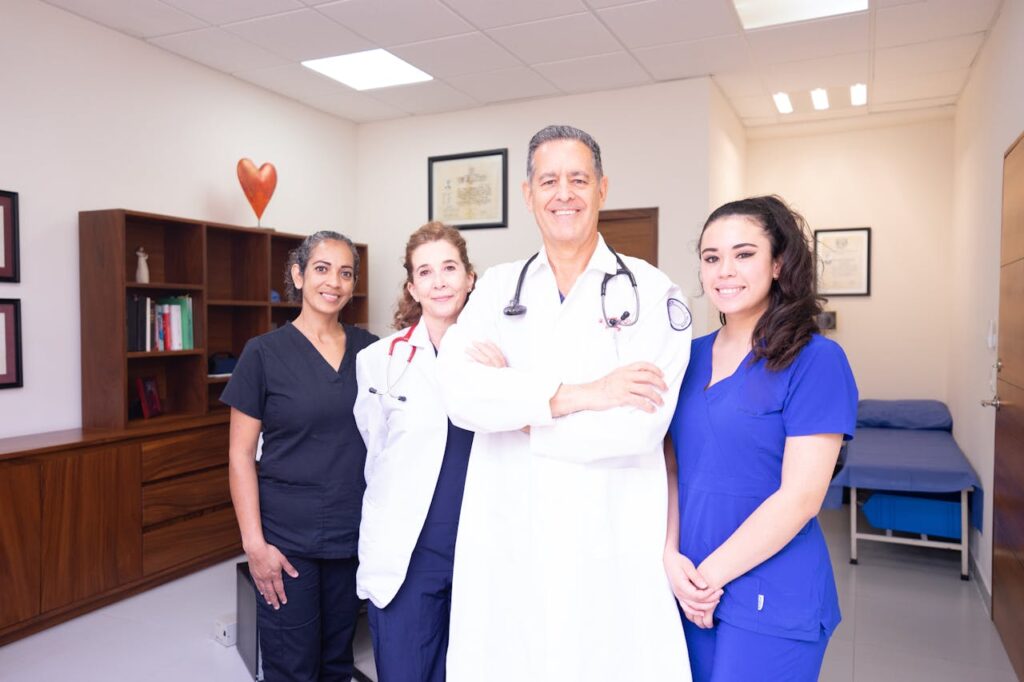 pexels-photo-8460371 Group of diverse healthcare professionals in a clinical setting, showcasing teamwork and care.